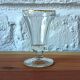 Antique footed liqueur glasses with gold trim from the early 20th century.
