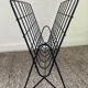 Vintage wired metal magazine rack