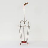 VINTAGE UMBRELLA STAND OF CURVED METAL, RED DETAILS AND A BAMBOO HANDLE, 1950S