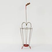 VINTAGE UMBRELLA STAND OF CURVED METAL, RED DETAILS AND A BAMBOO HANDLE, 1950S