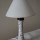 Table lamp for bedside use in earthenware with a wooden base.