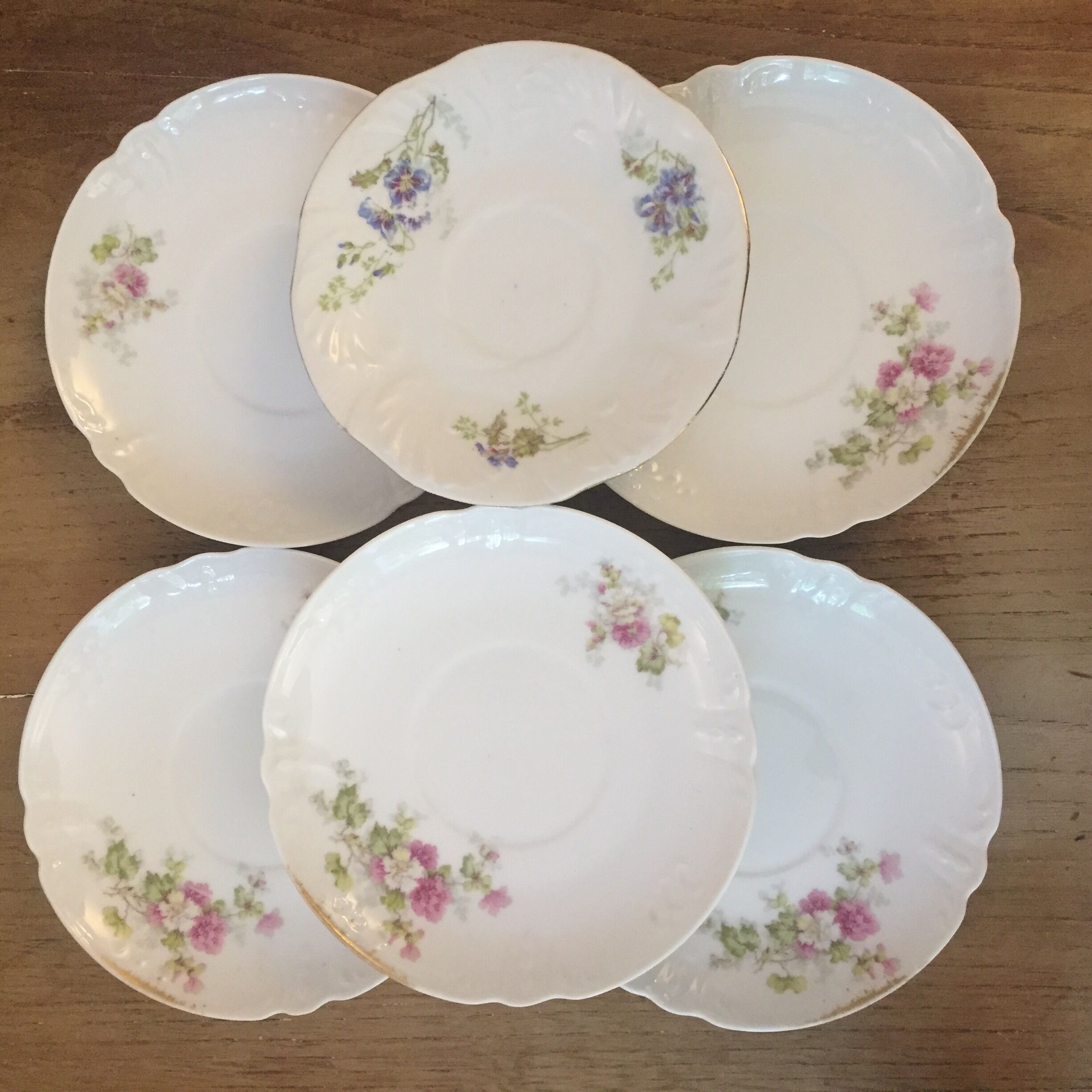 6 antique cups and mismatched saucers