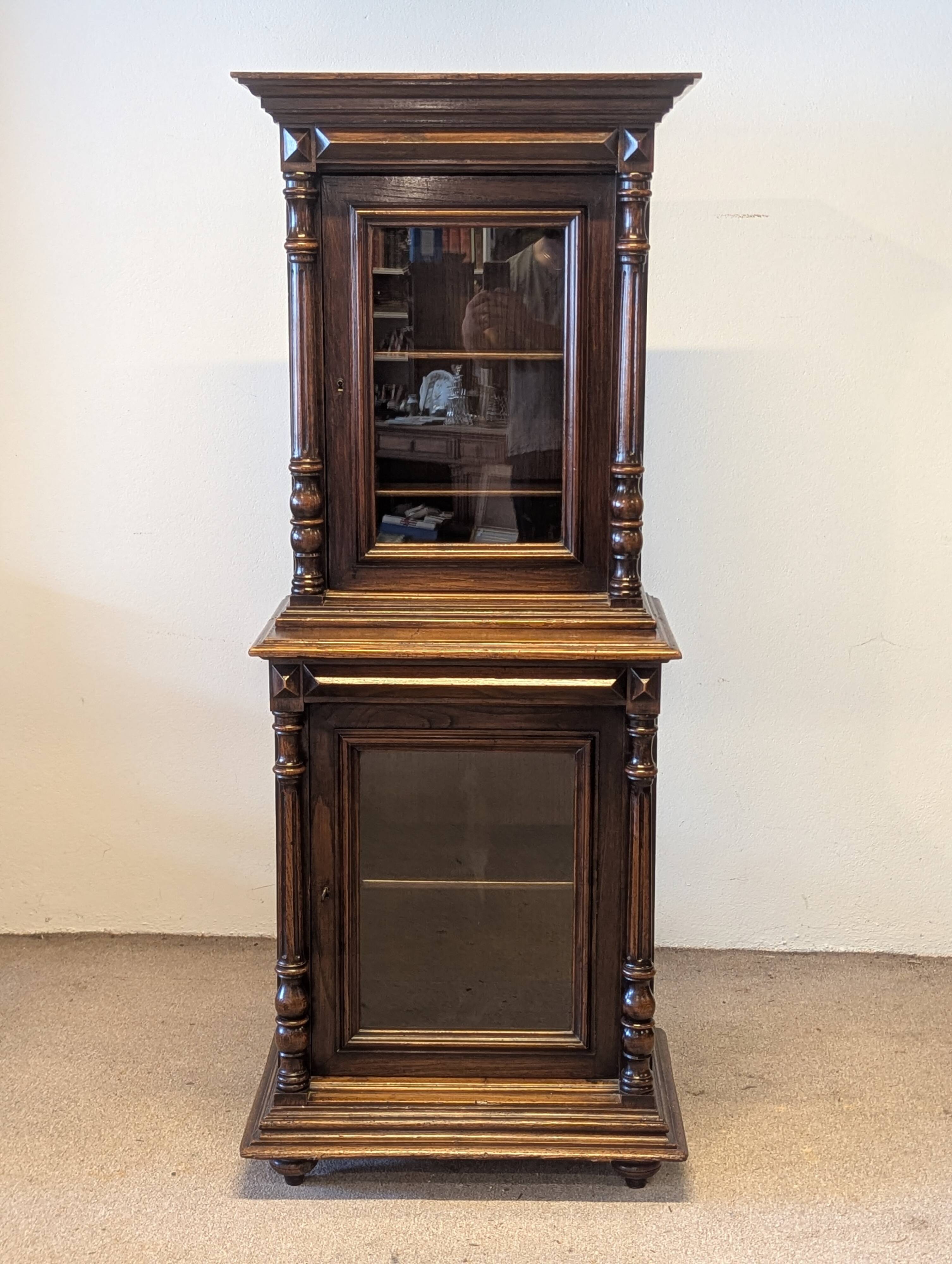 Two-body display cabinet in oak, Henri II style.