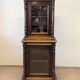 Two-body display cabinet in oak, Henri II style.