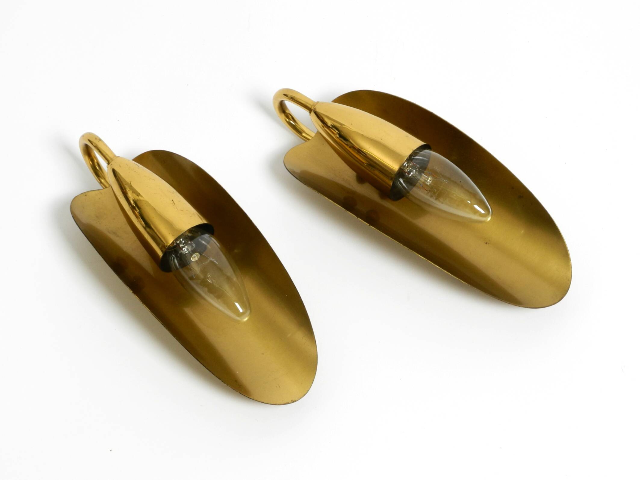 Two magical original Mid Century Modern bag brass wall lamps
