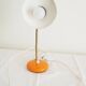 Orange colored metal desk lamp from the 1960s-1970s