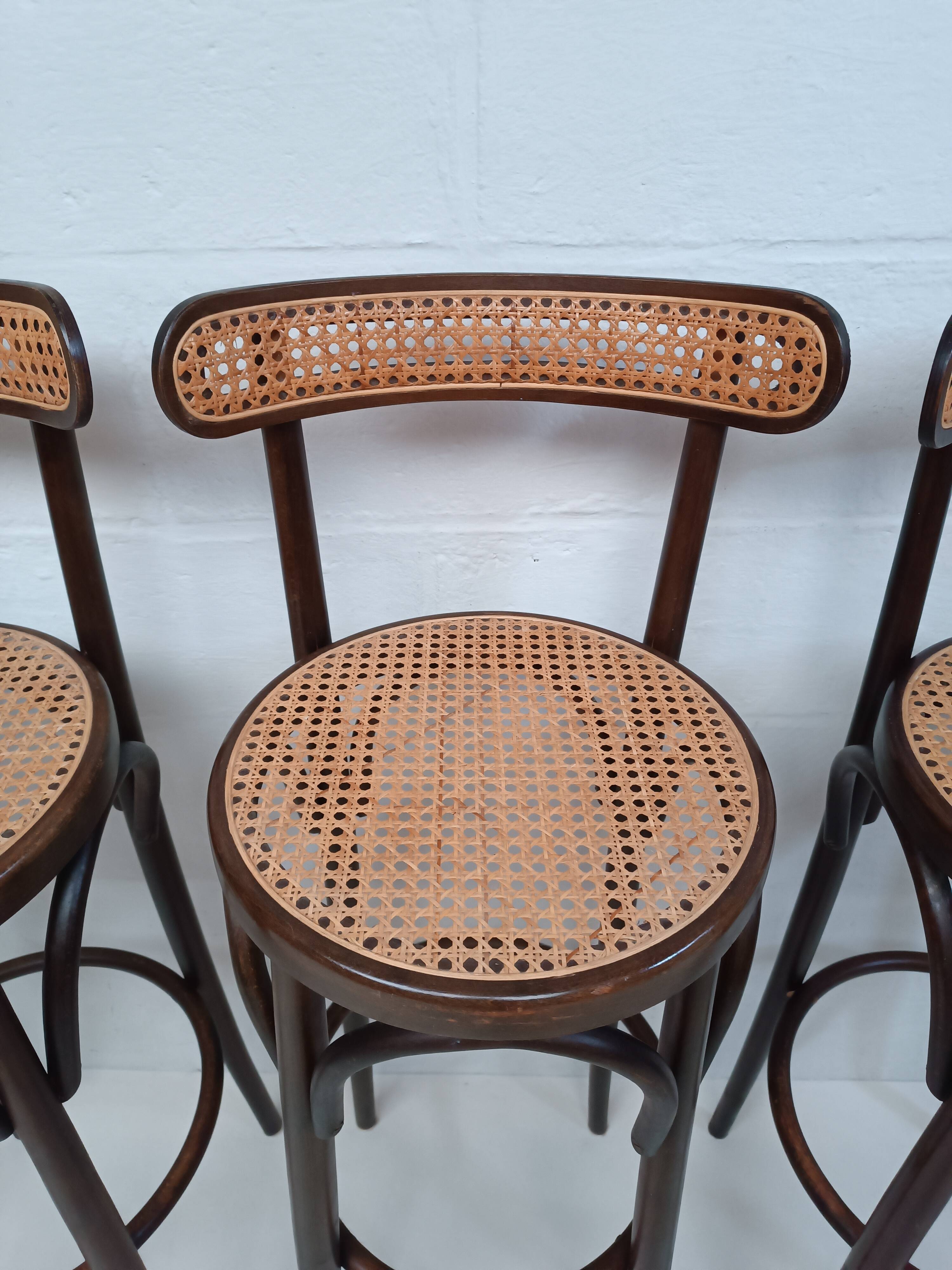 4 curved wood and cane bar stools
