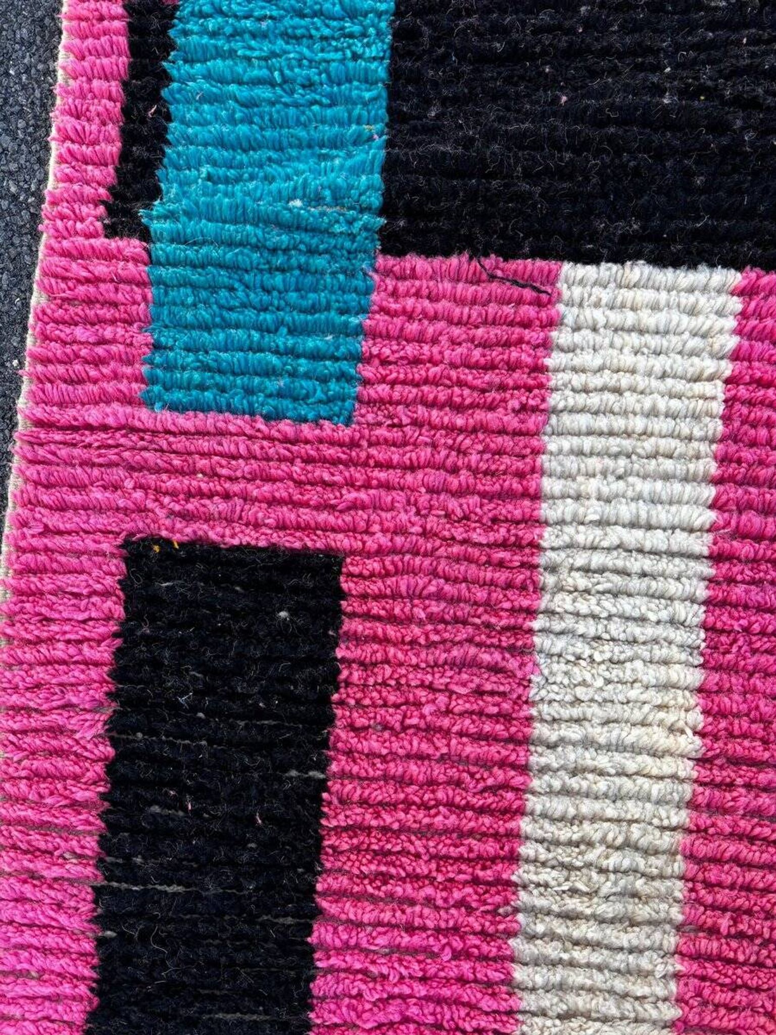 Moroccan Berber rug corridor in pink and blue wool.