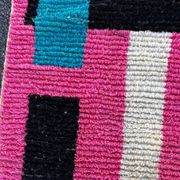 Moroccan Berber rug corridor in pink and blue wool.