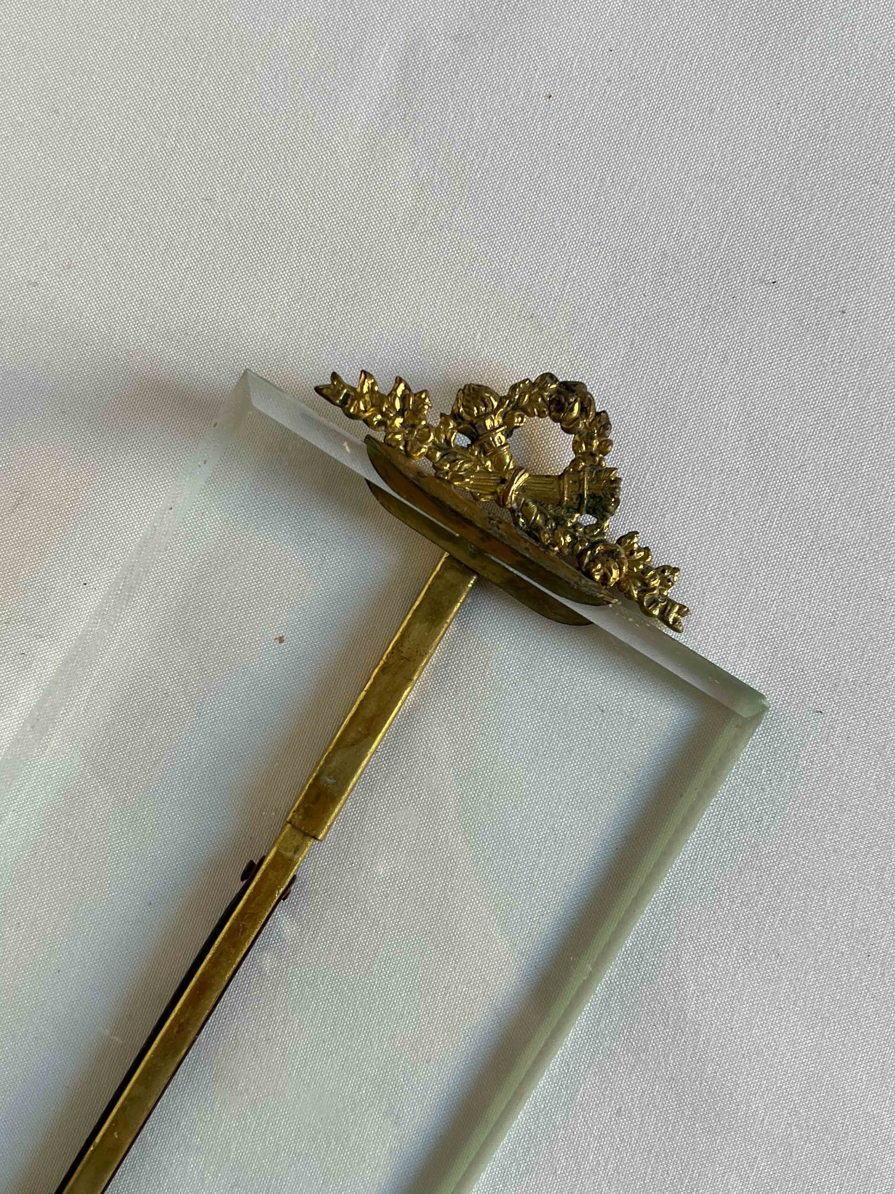 Brass frame and beveled glass