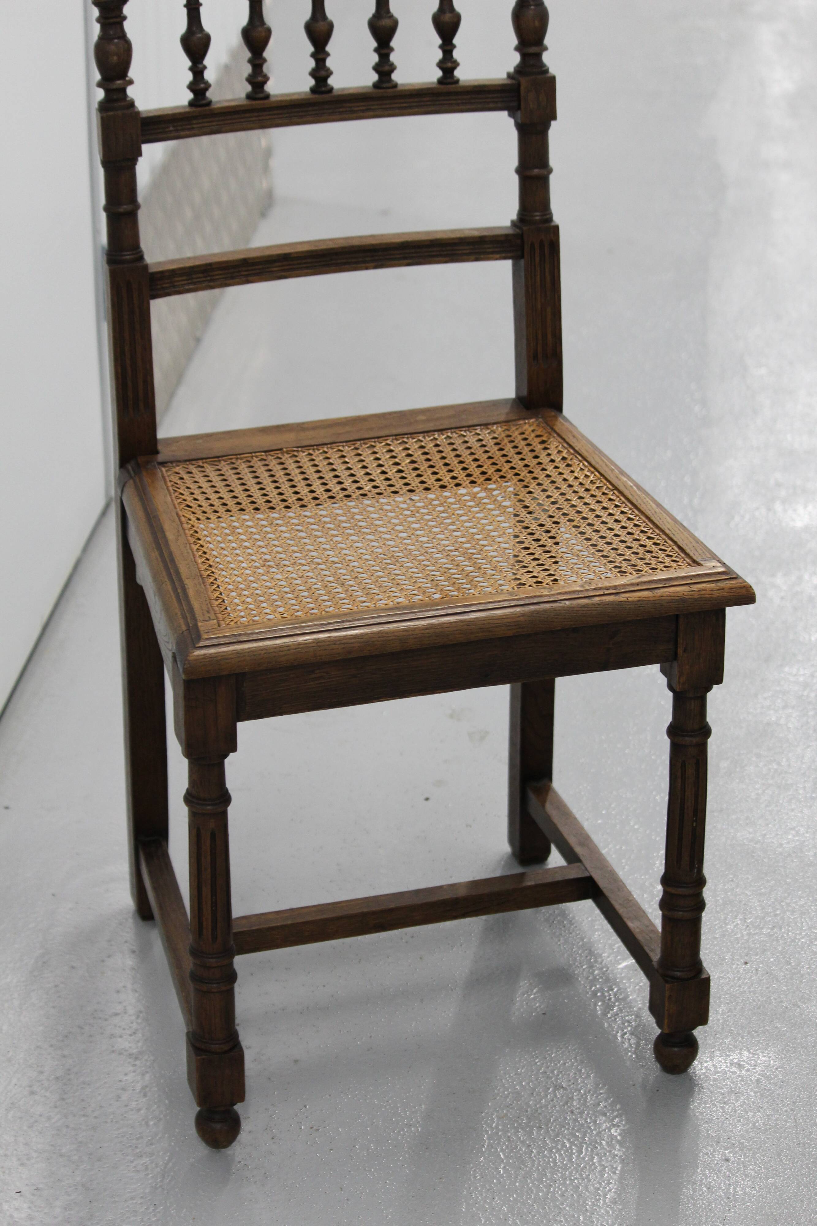Pair of wooden caned chairs