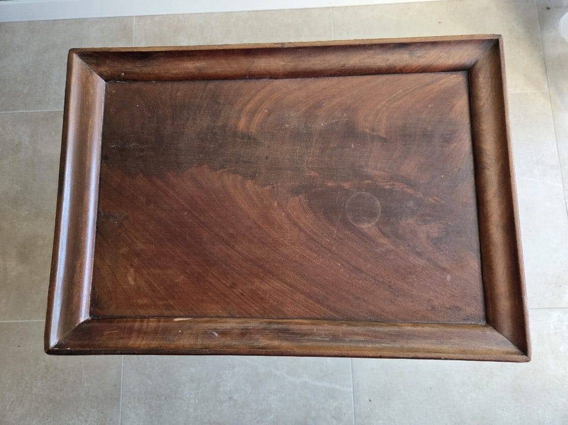 Antique wooden sewing cabinet with mirror and storage.
