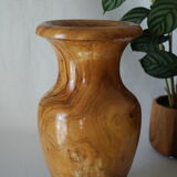 Artisanal vase in wood turned from varnished olive tree