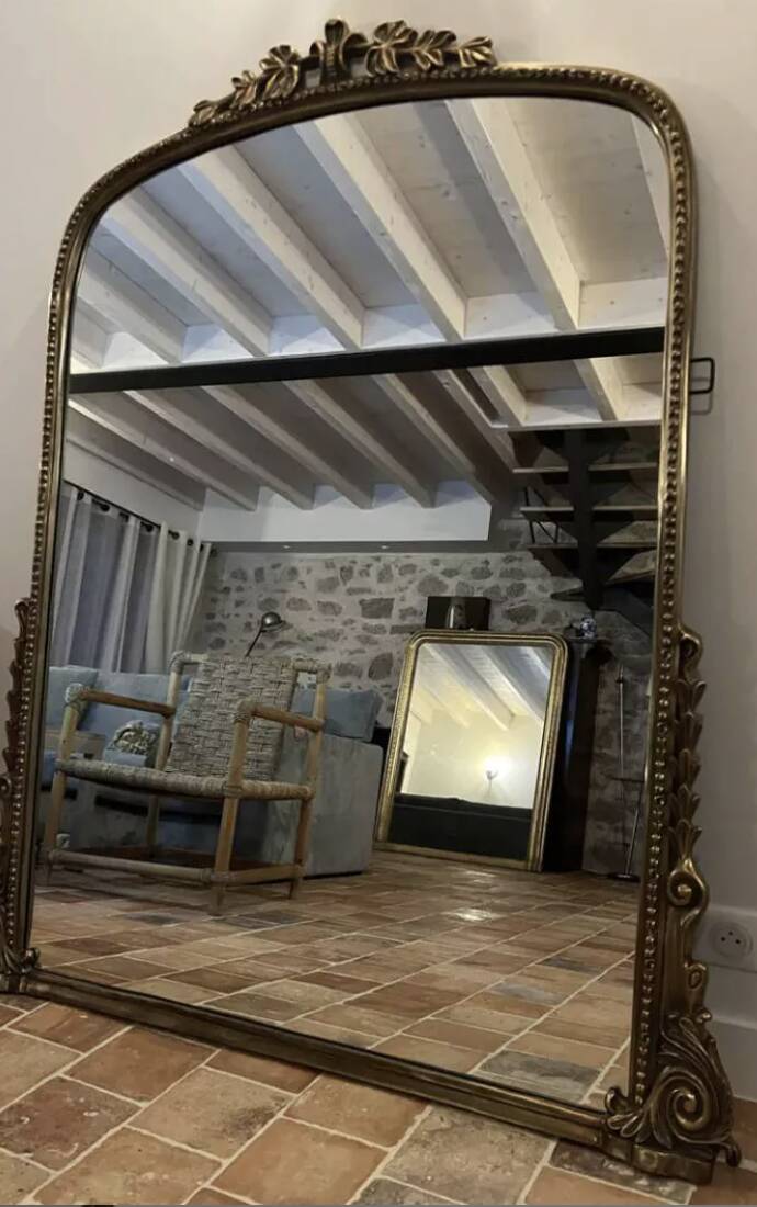 Large gilded mirror with pediment
