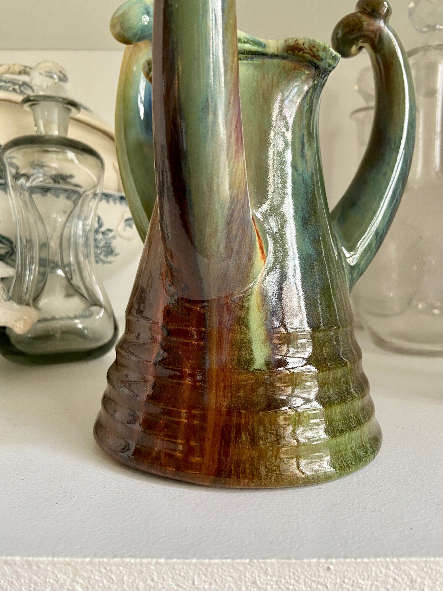 Turquoise glazed ceramic pitcher