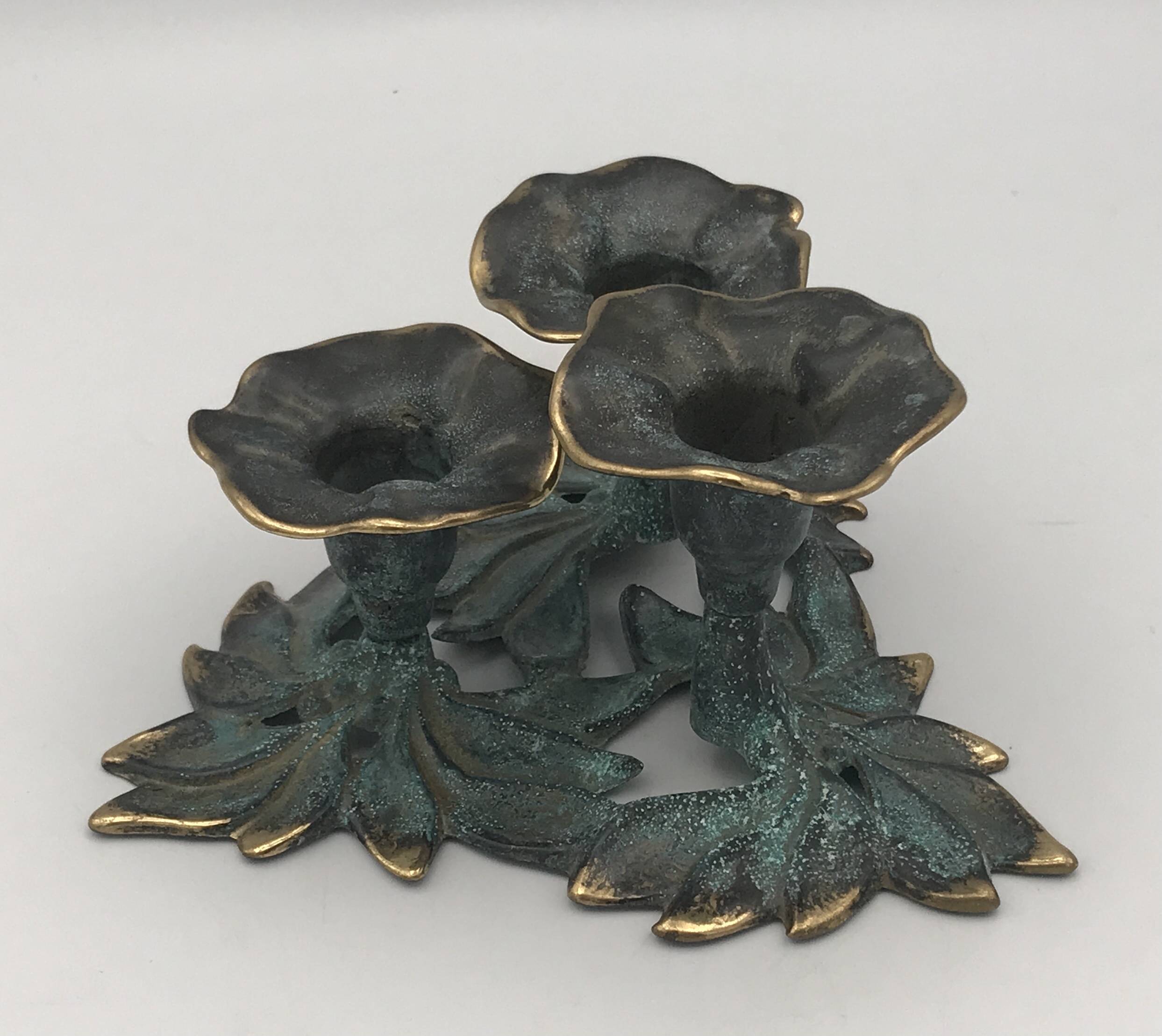 3-flower brass candlestick with green patina