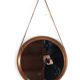 Round teak danish mirror with leather strap