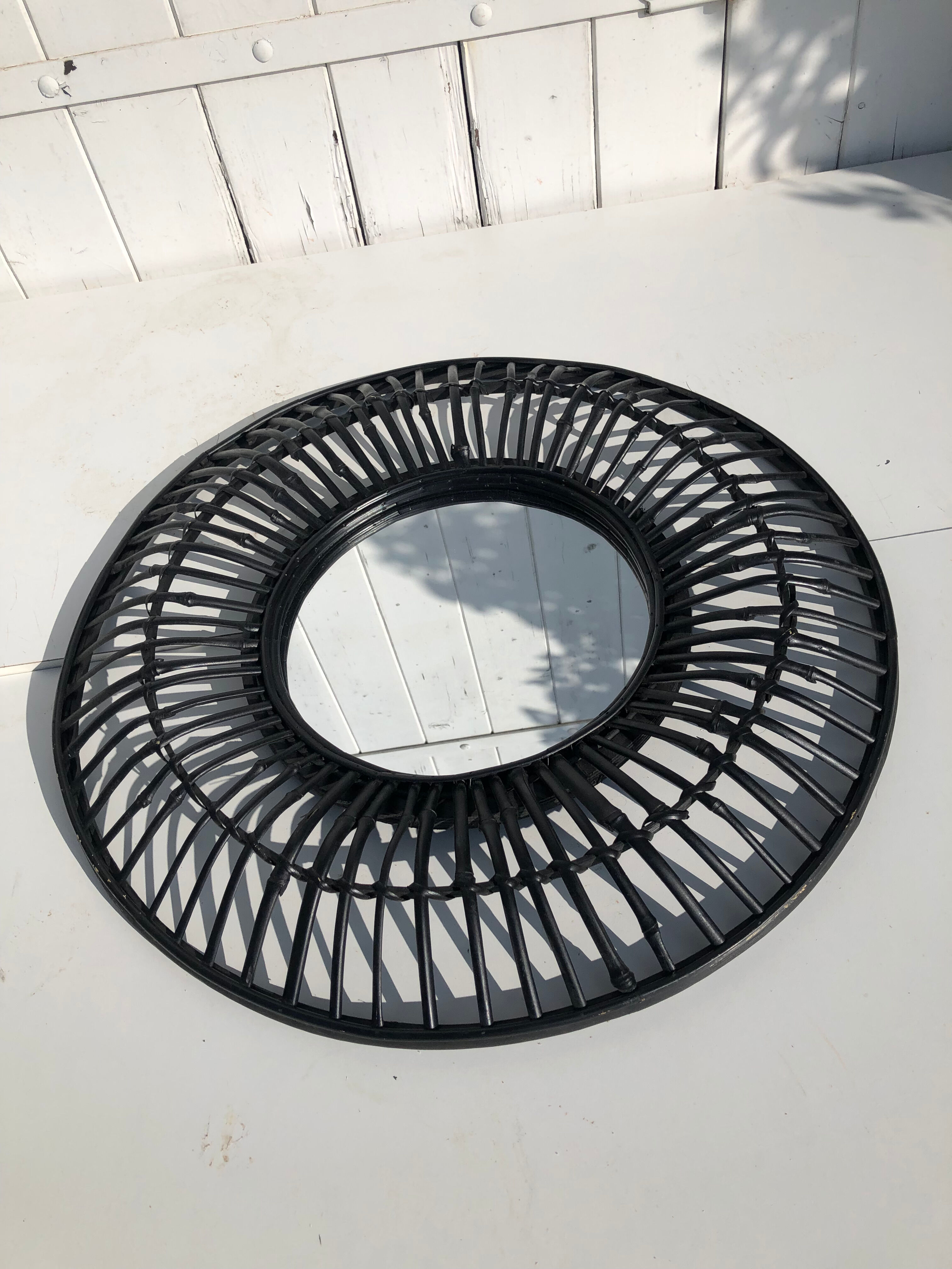 Round black rattan mirror