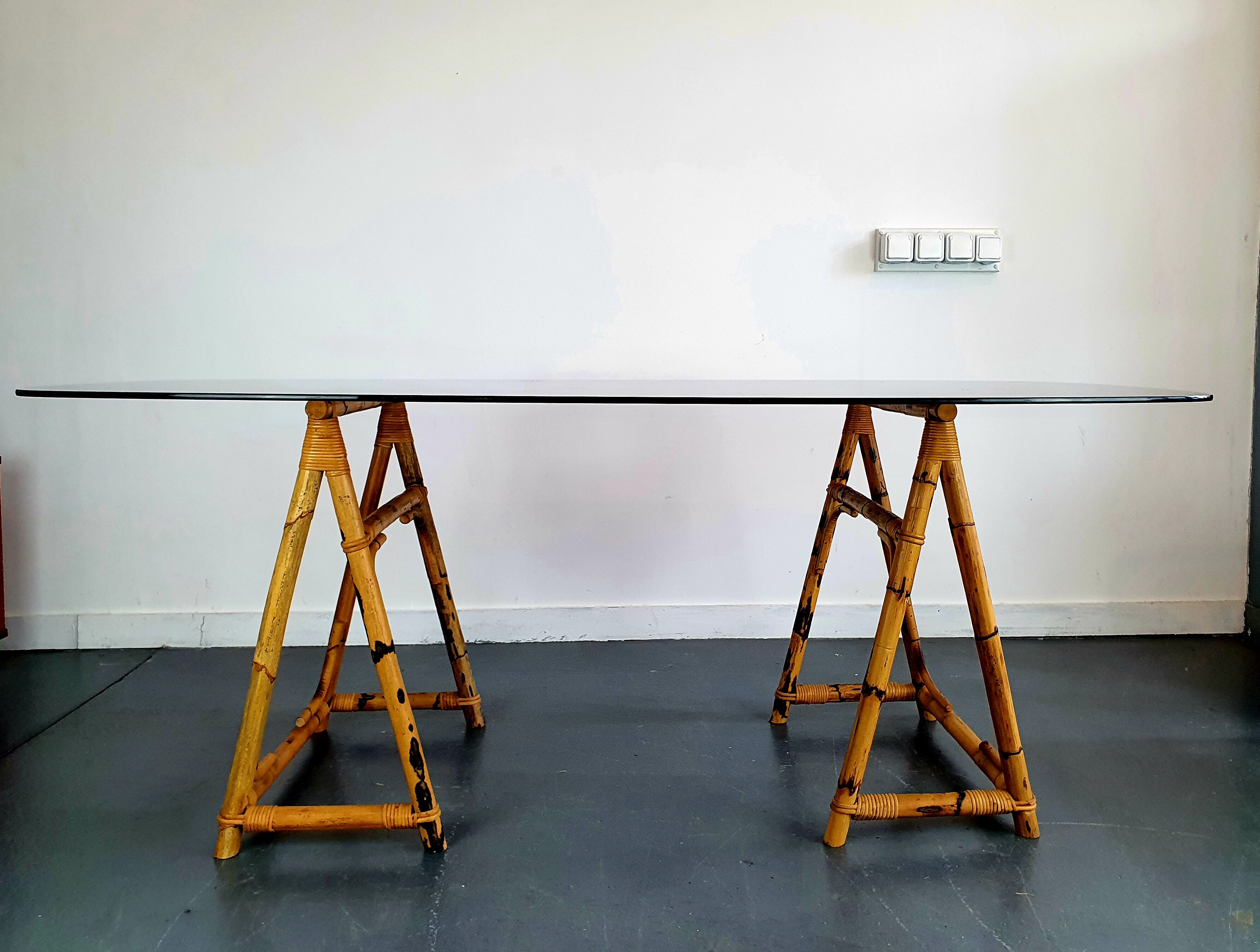 1970s dining table with bamboo trestle legs and smoked glass