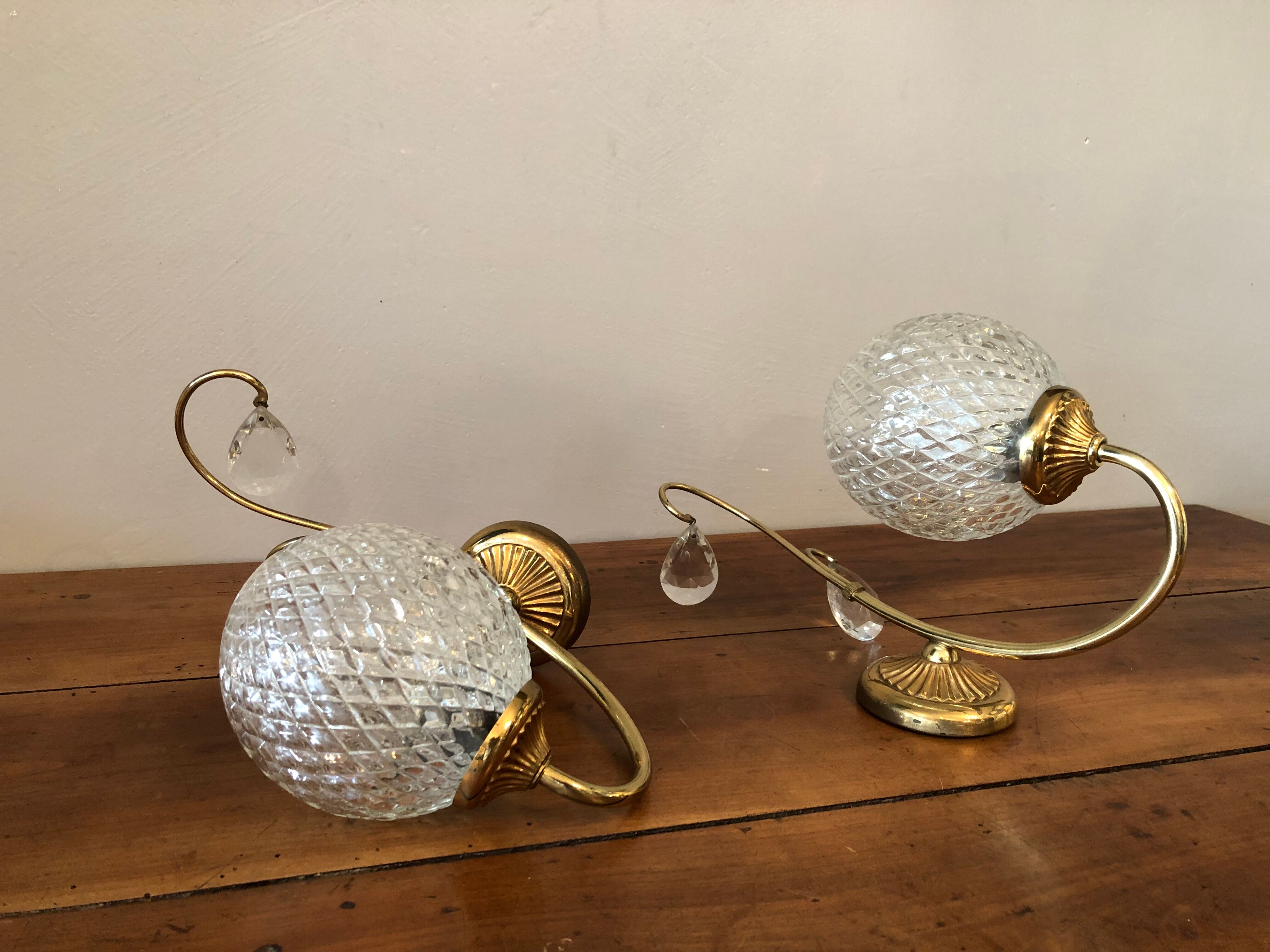 Duo of brass and glass wall lamps