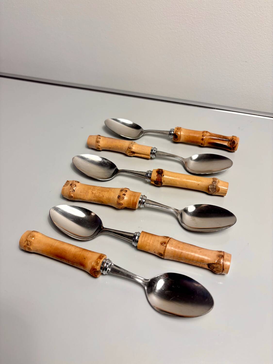 Set of 6 vintage dessert spoons with bamboo handles.