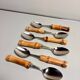 Set of 6 vintage dessert spoons with bamboo handles.