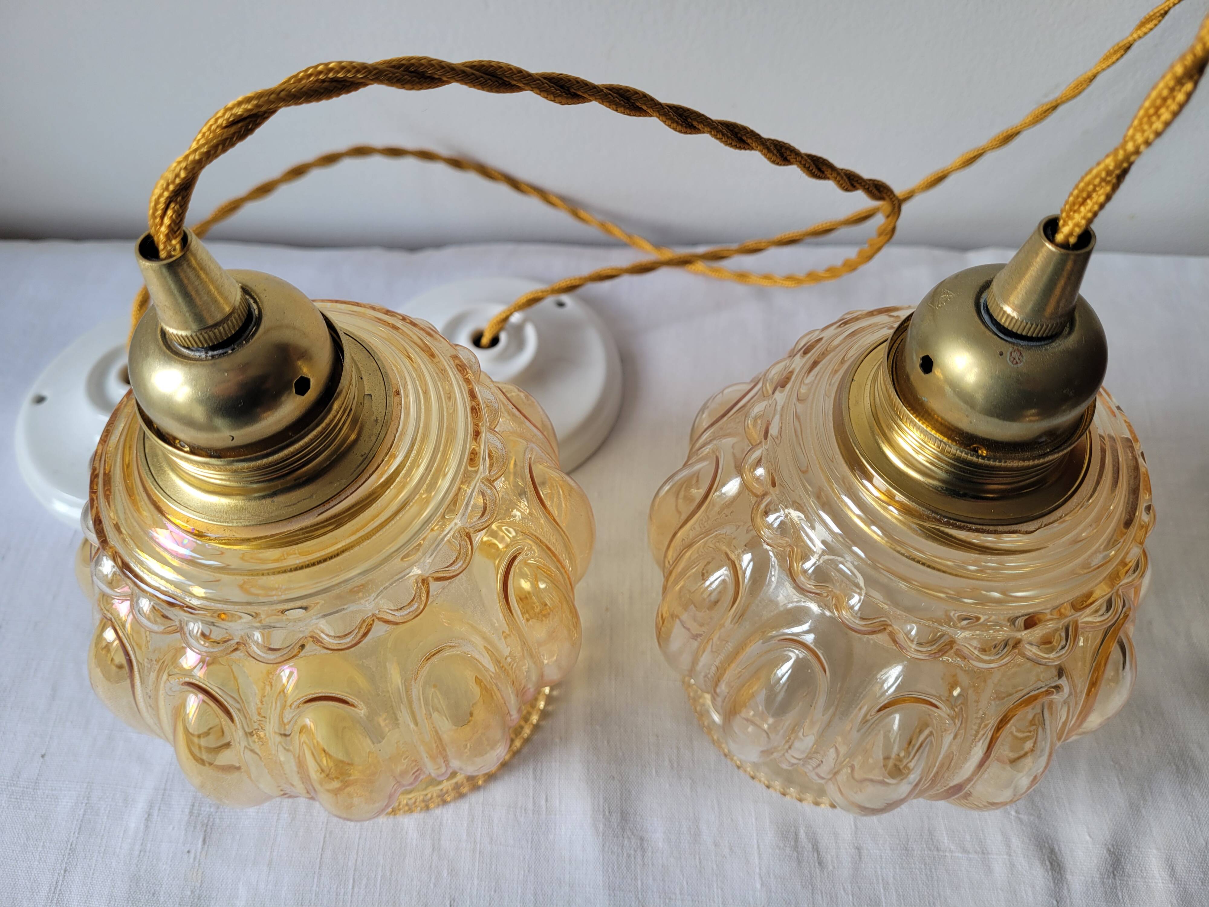 Duo of amber molded glass pendant lights