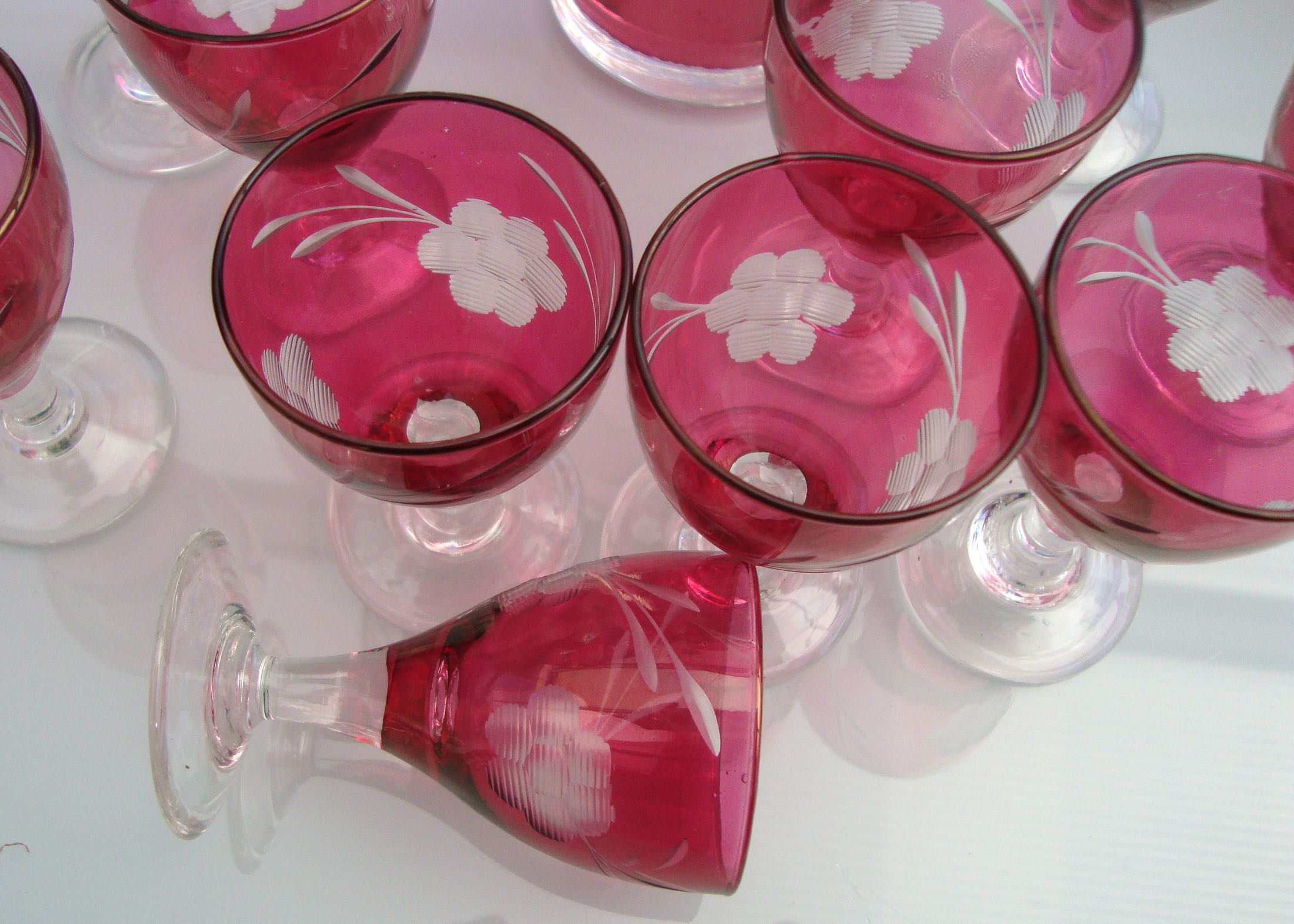 10 glasses and carafe with alcohol or liquor