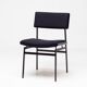 Set of four entirely black Hulmefa dining chairs, Architectural Modernism.