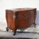 Old chest, carved wooden chest, curved chest on wheels, interior decoration