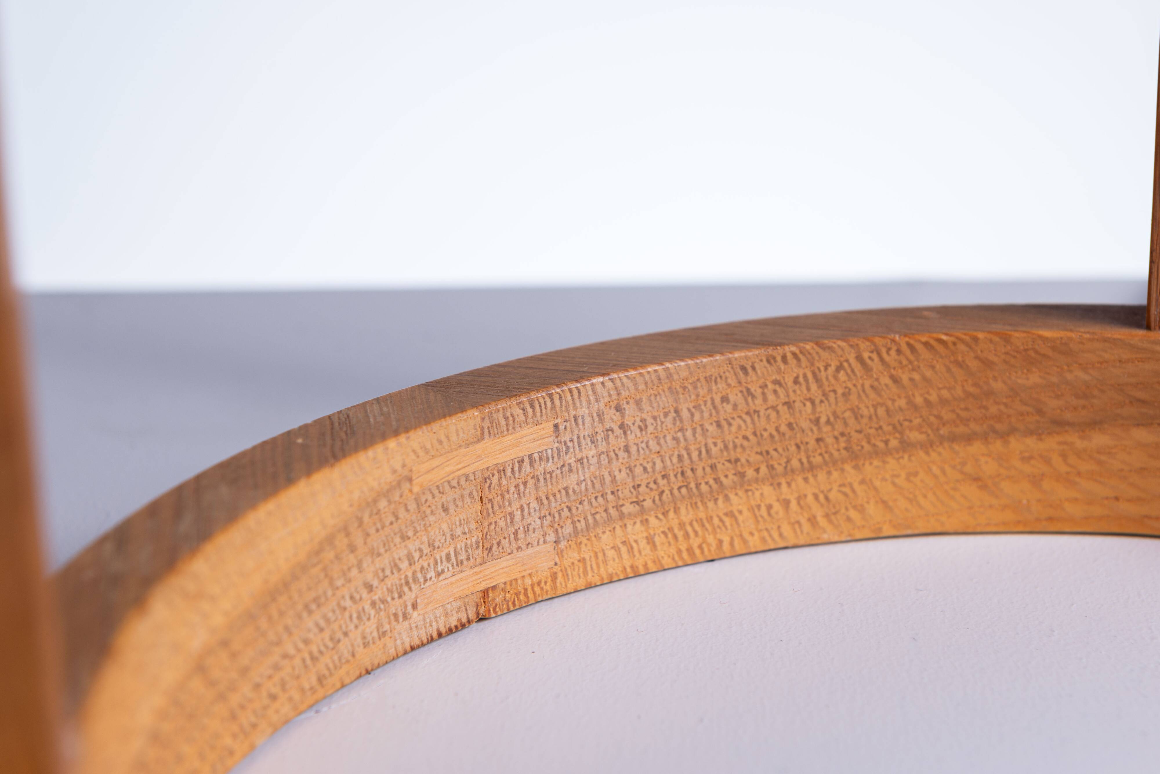 Bent oak wood table lamp with orange glass shade