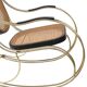 Modernist rocking chair in gilded brass and cane.