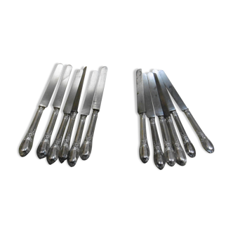 SILVER KNIVES FILLED WITH MINERVA PUNCH LATE 19TH CENTURY RIBBON AND FLOWER DECOR