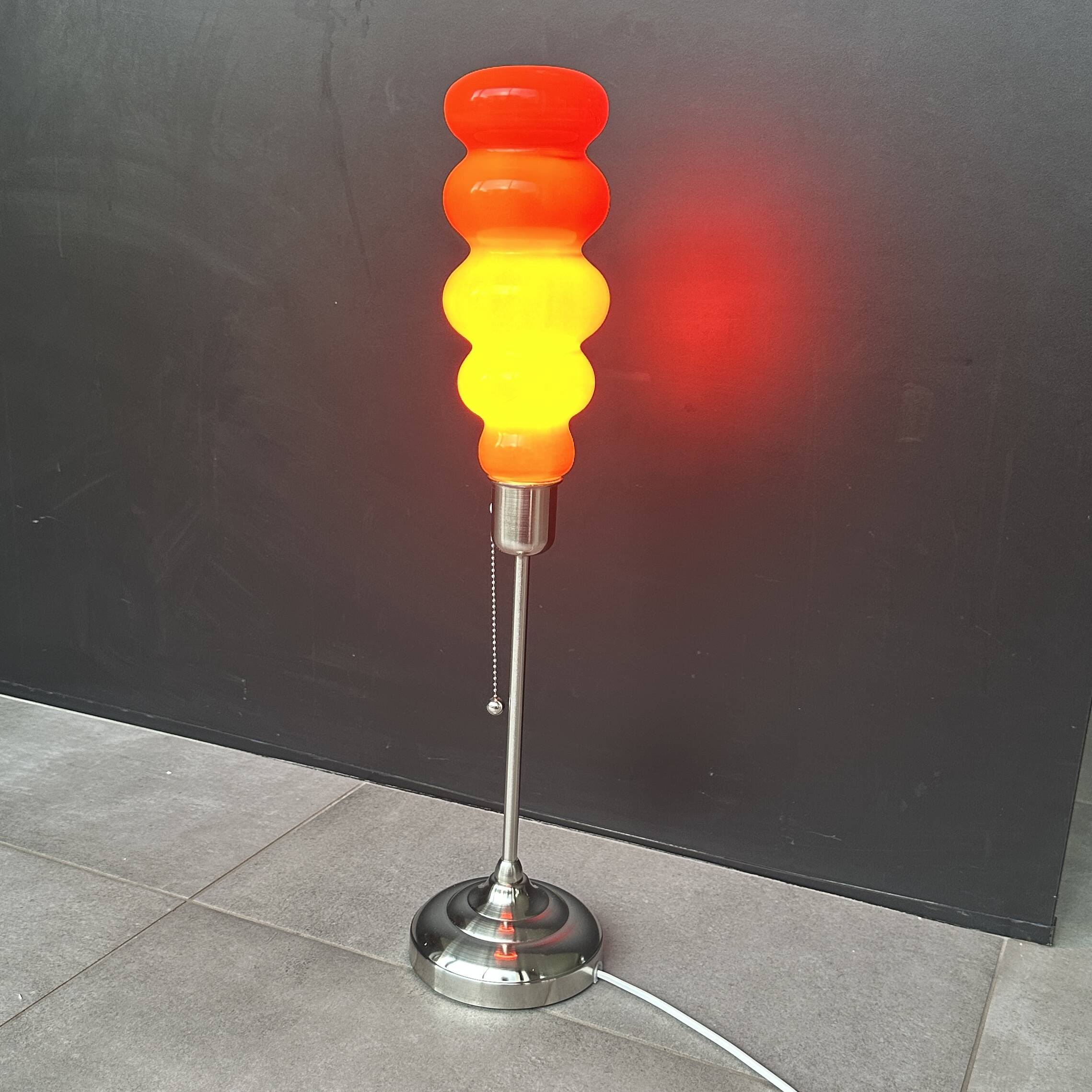 Modern vintage pop design lamp in 70’s style orange glass
