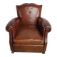 Club chair with moustache back and lion feet.
