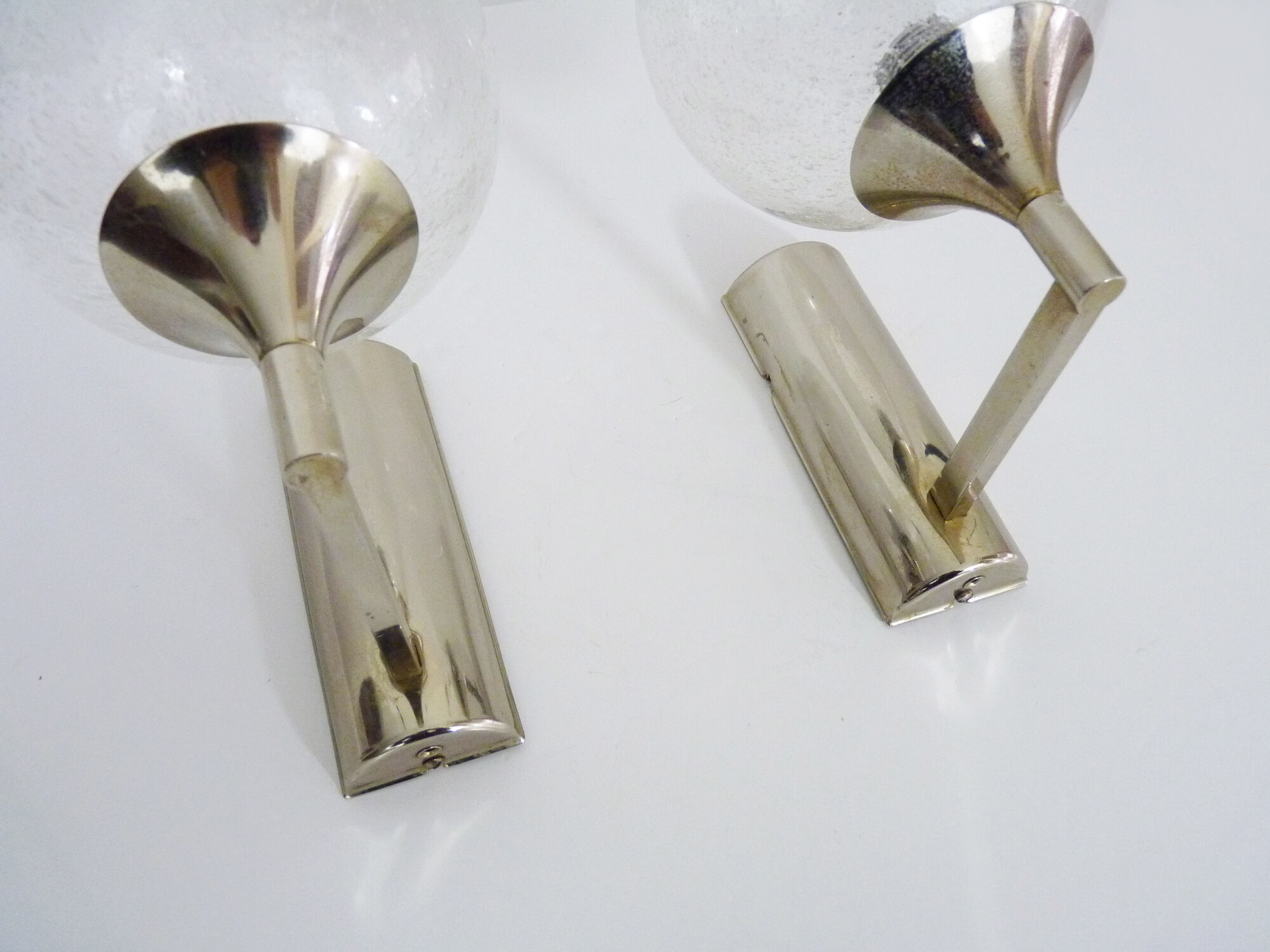 Pair of chrome metal wall sconces and blown glass