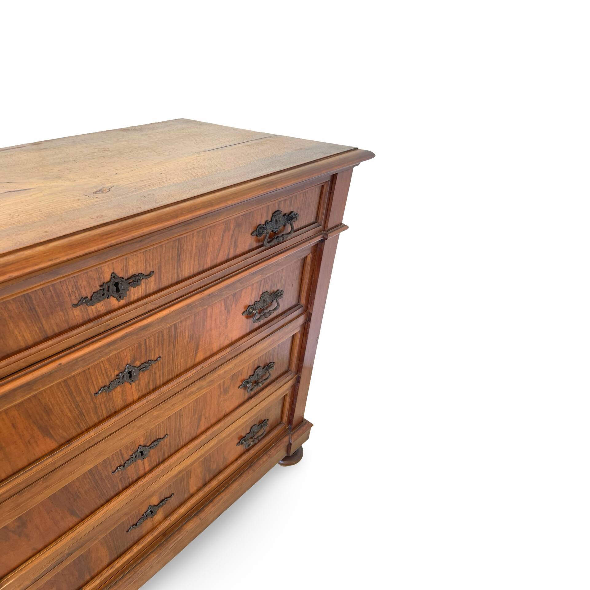 Antique walnut commode with bronze handles in the shape of a lion's mask,