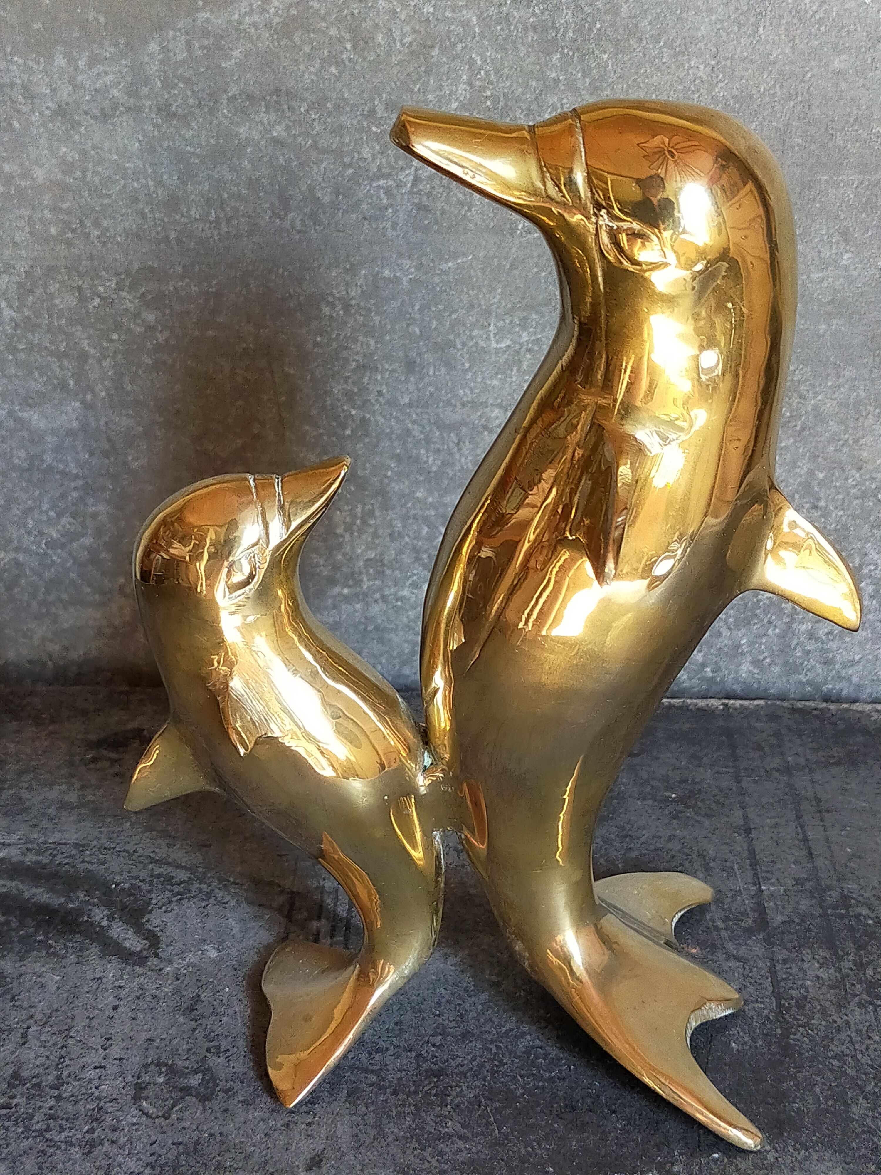 Vintage solid brass dolphins