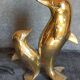 Vintage solid brass dolphins