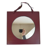 Mirror covered in burgundy leather
