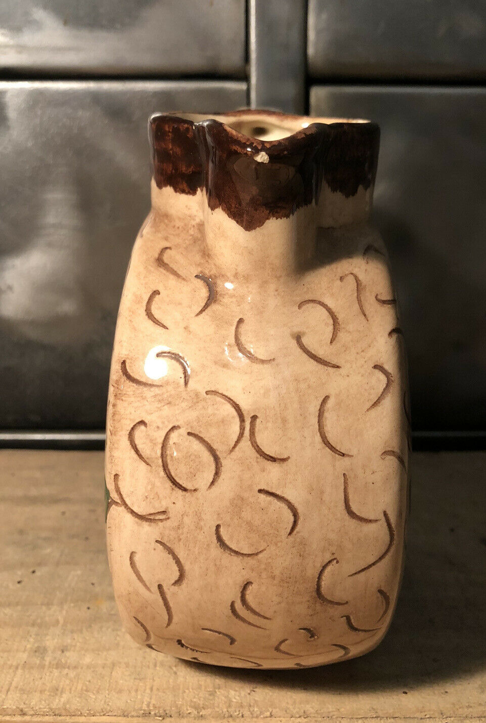 Ceramic pitcher with floral decoration signed Lucq