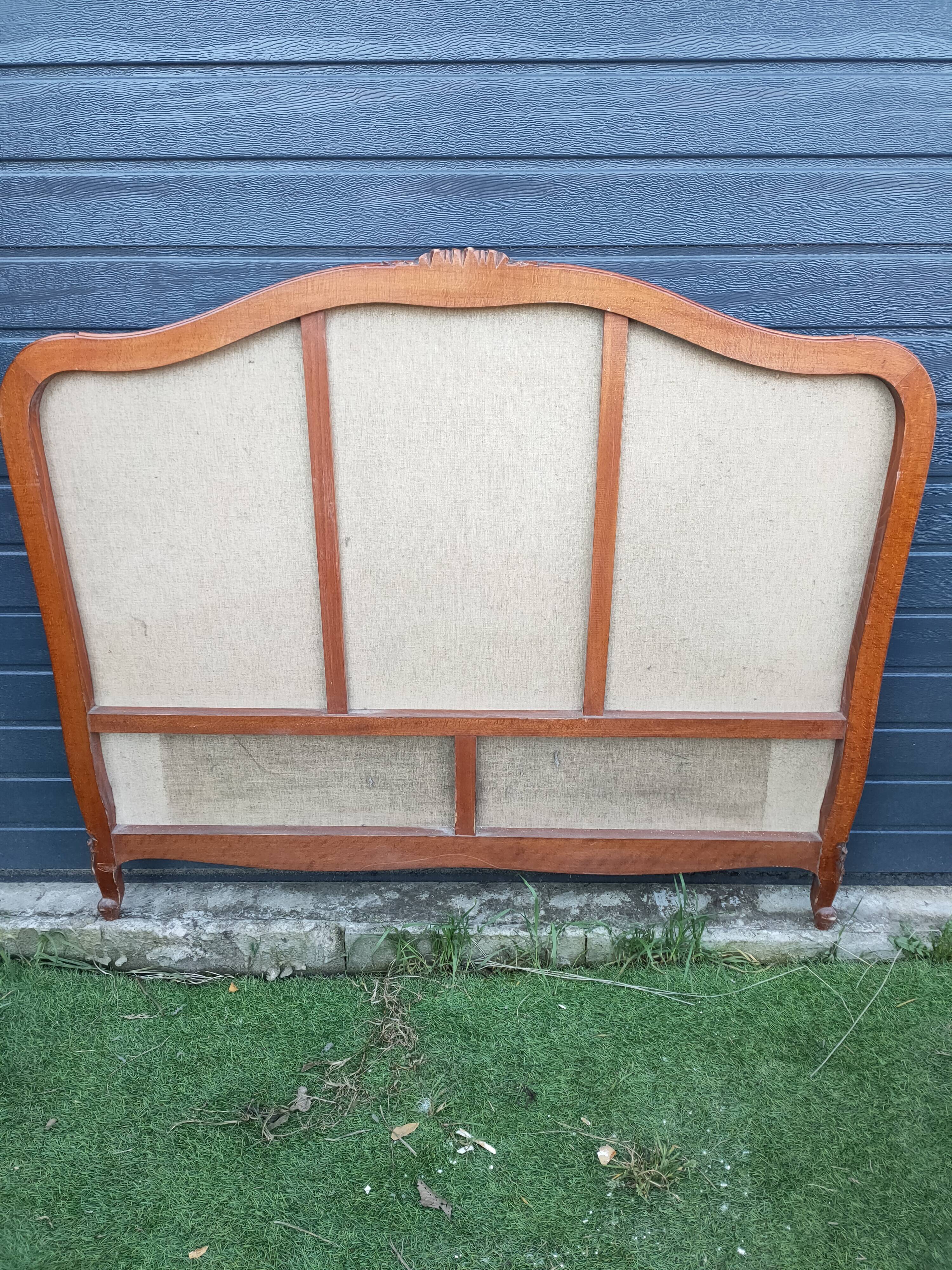 antique fabric and wood headboard