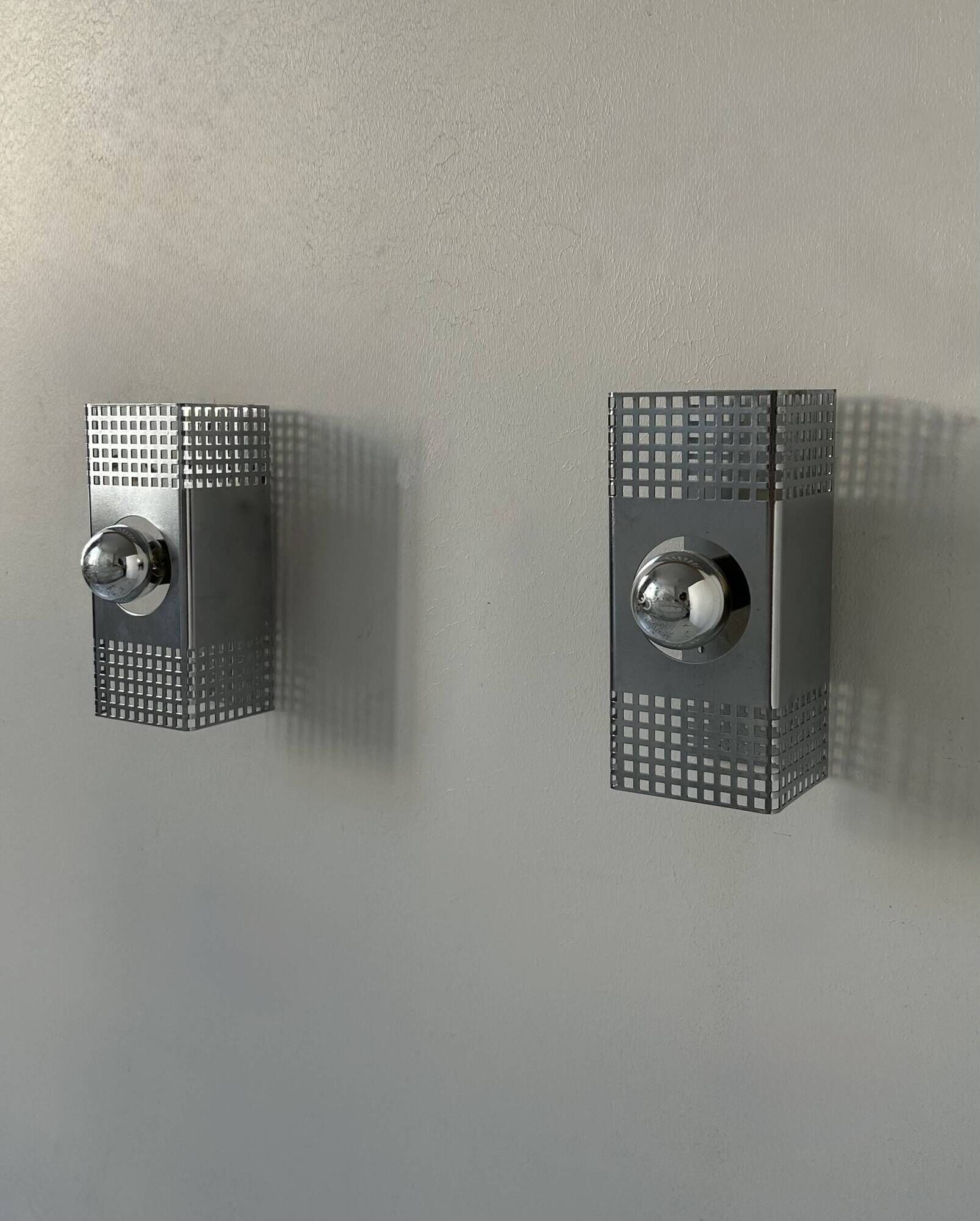 Pair of vintage wall lights, chrome-plated metal, France 1970.