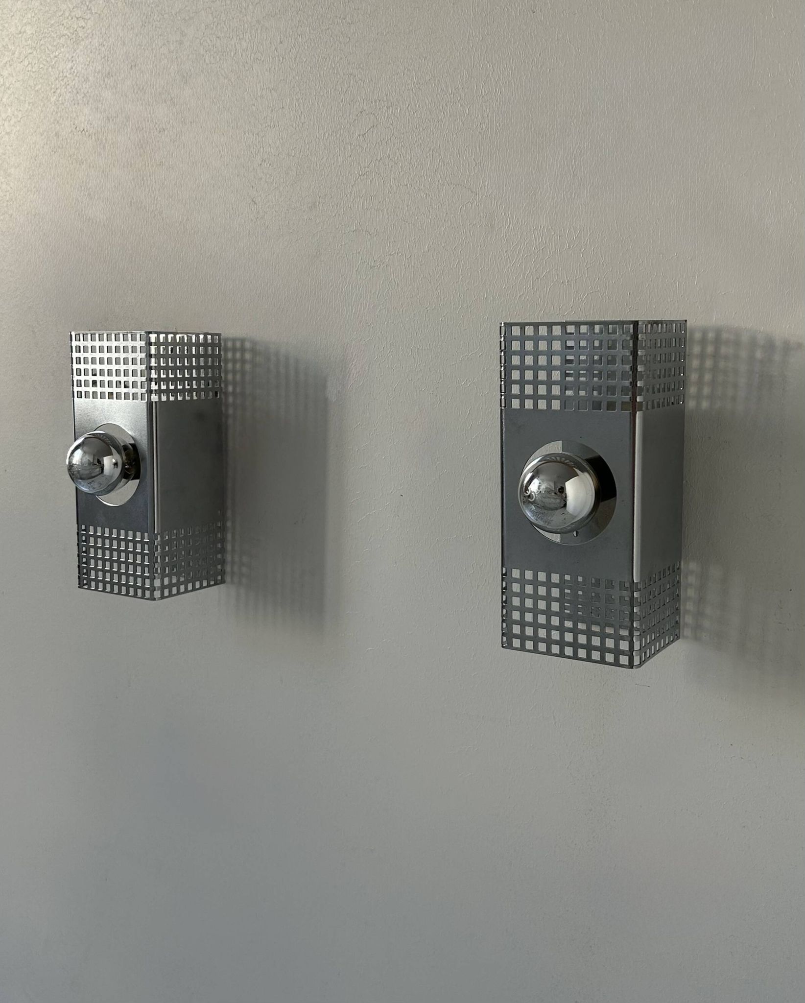 Pair of vintage wall lights, chrome-plated metal, France 1970.