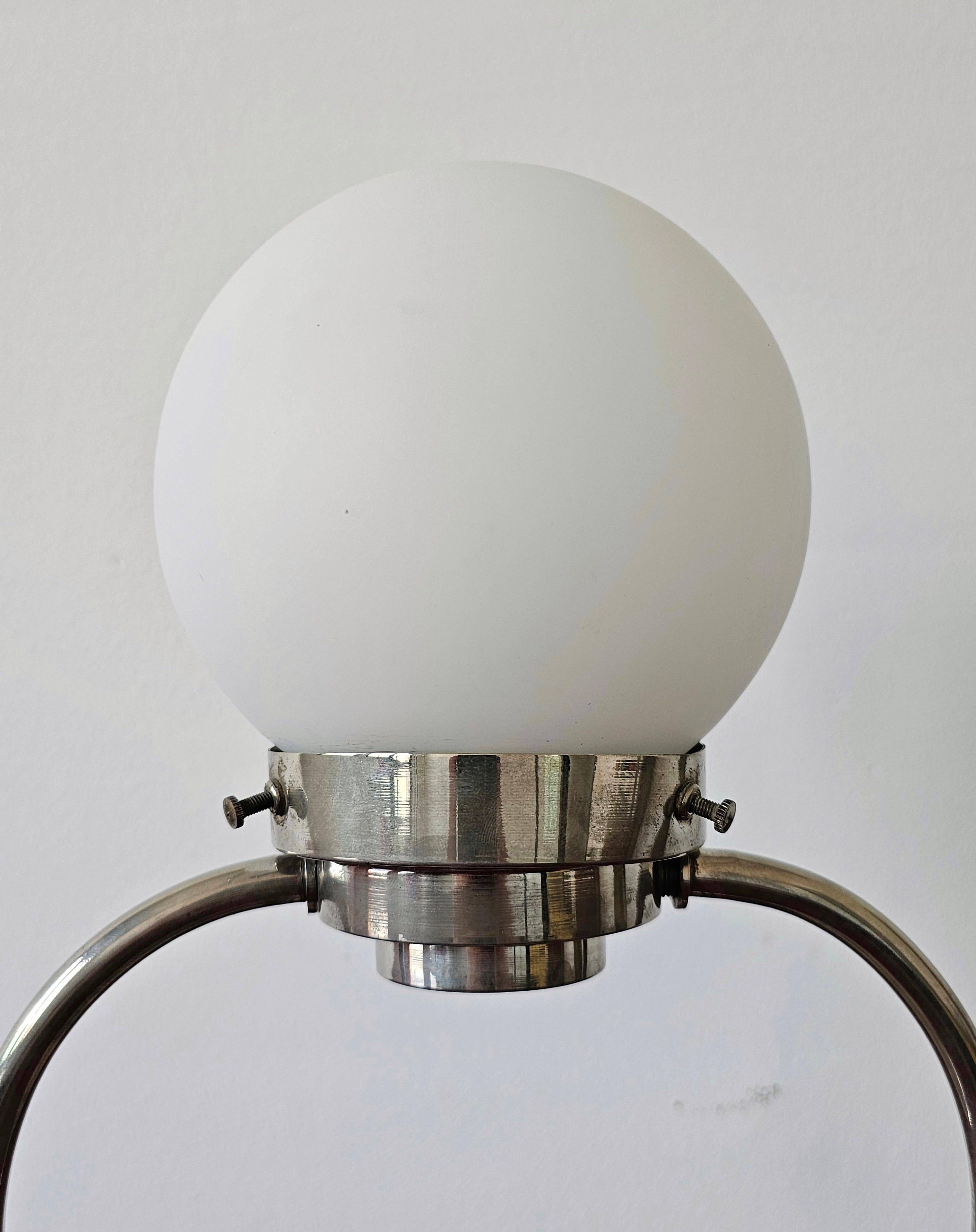 Art Deco table lamp with a spherical opaline glass shade and chrome base from the 1930s.