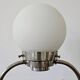 Art Deco table lamp with a spherical opaline glass shade and chrome base from the 1930s.