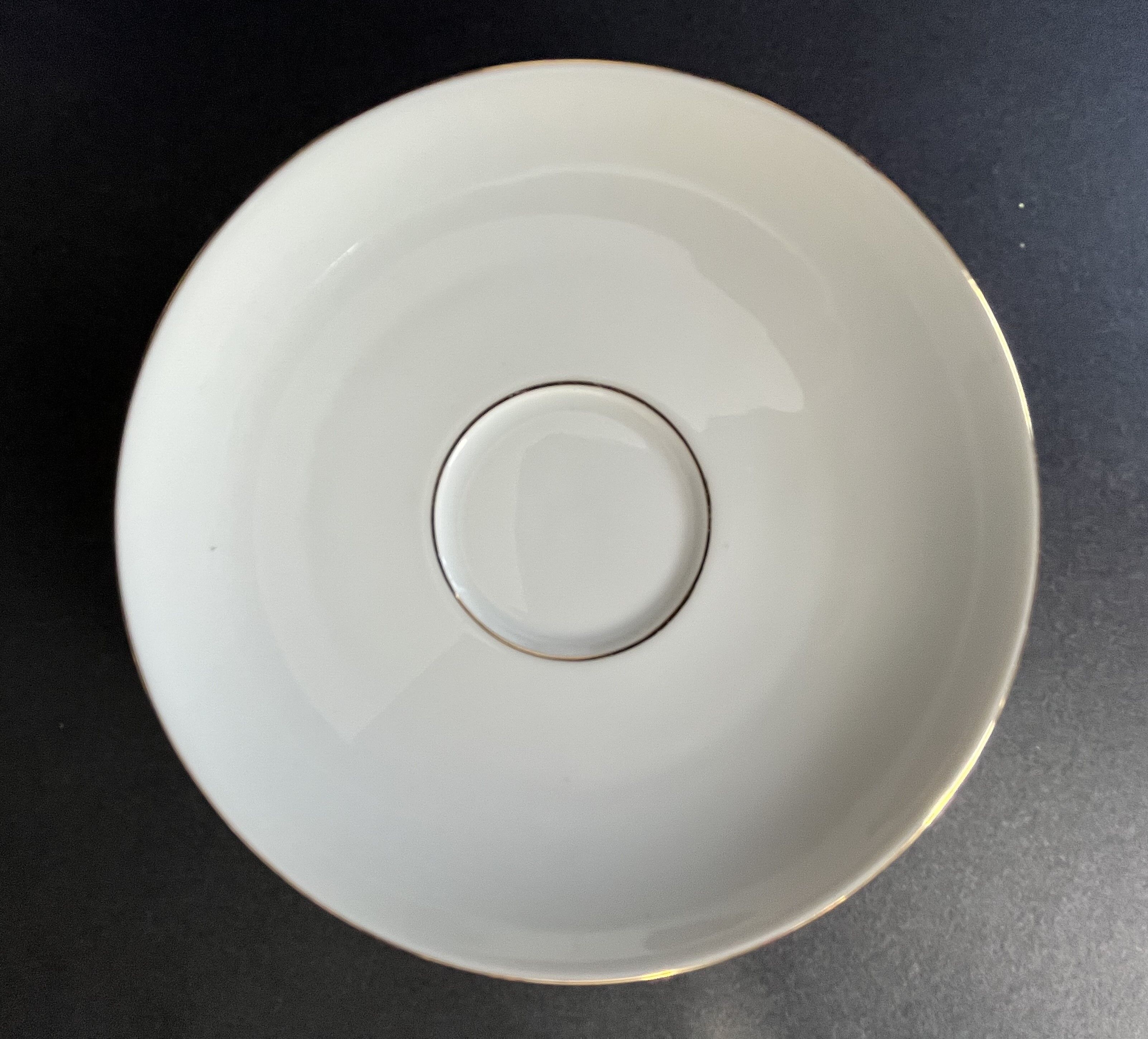 Set of 4 porcelain cups and sub-cups