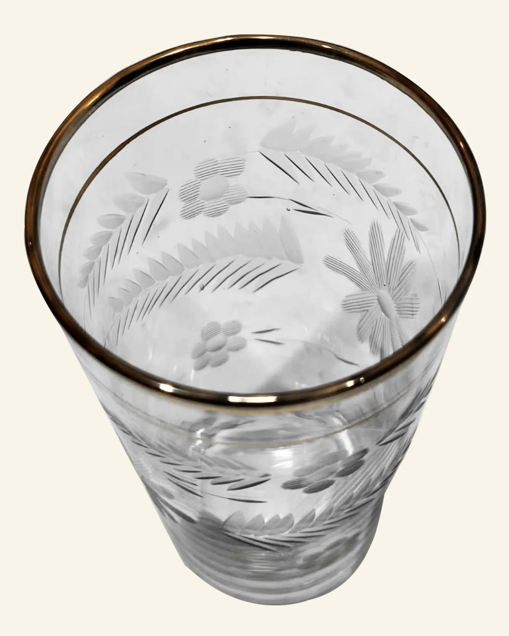 Four engraved crystal glasses from La Granja, with gilded edges, early 20th century.