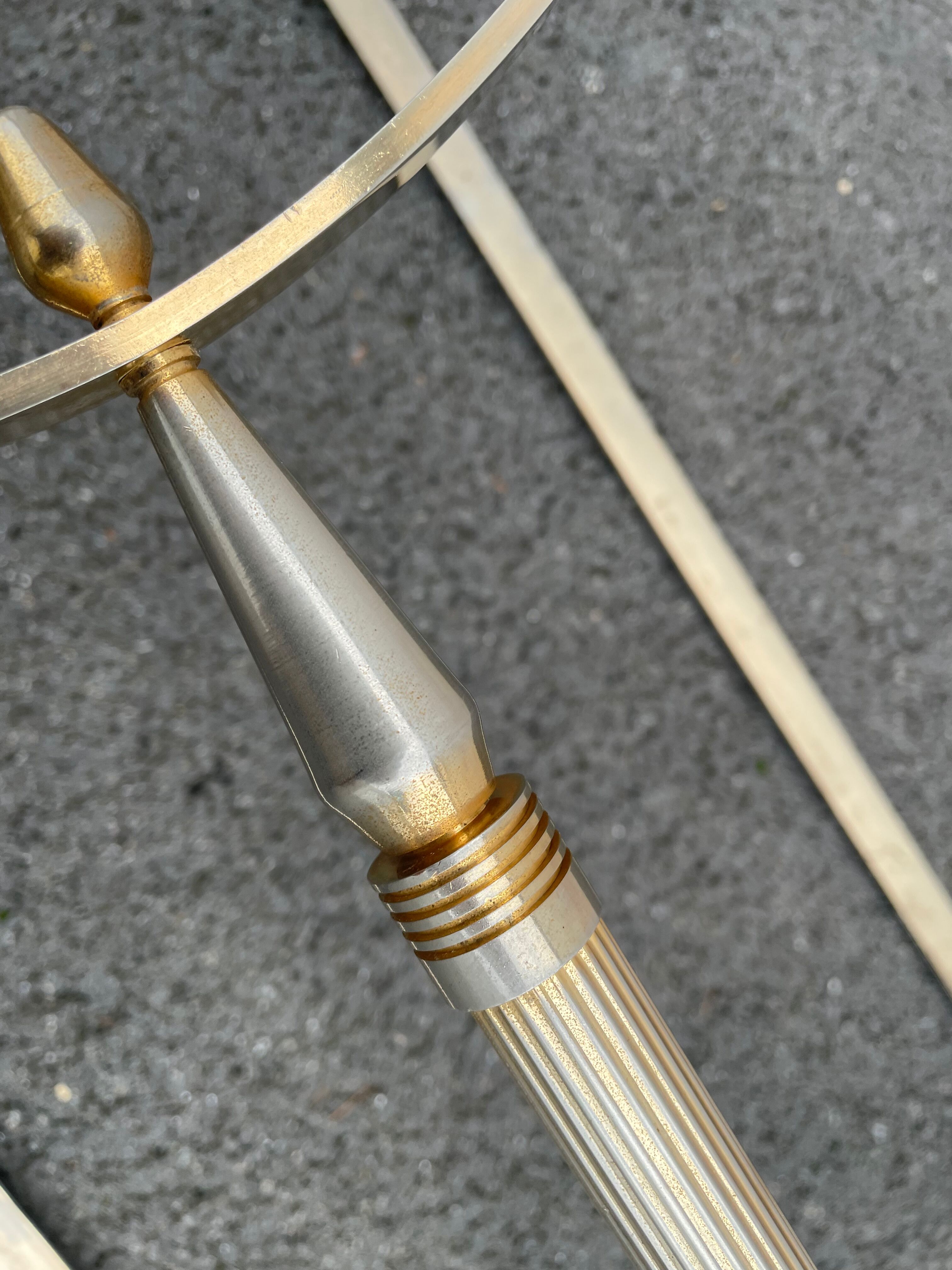Coffee table in gilded brass and veined green marble