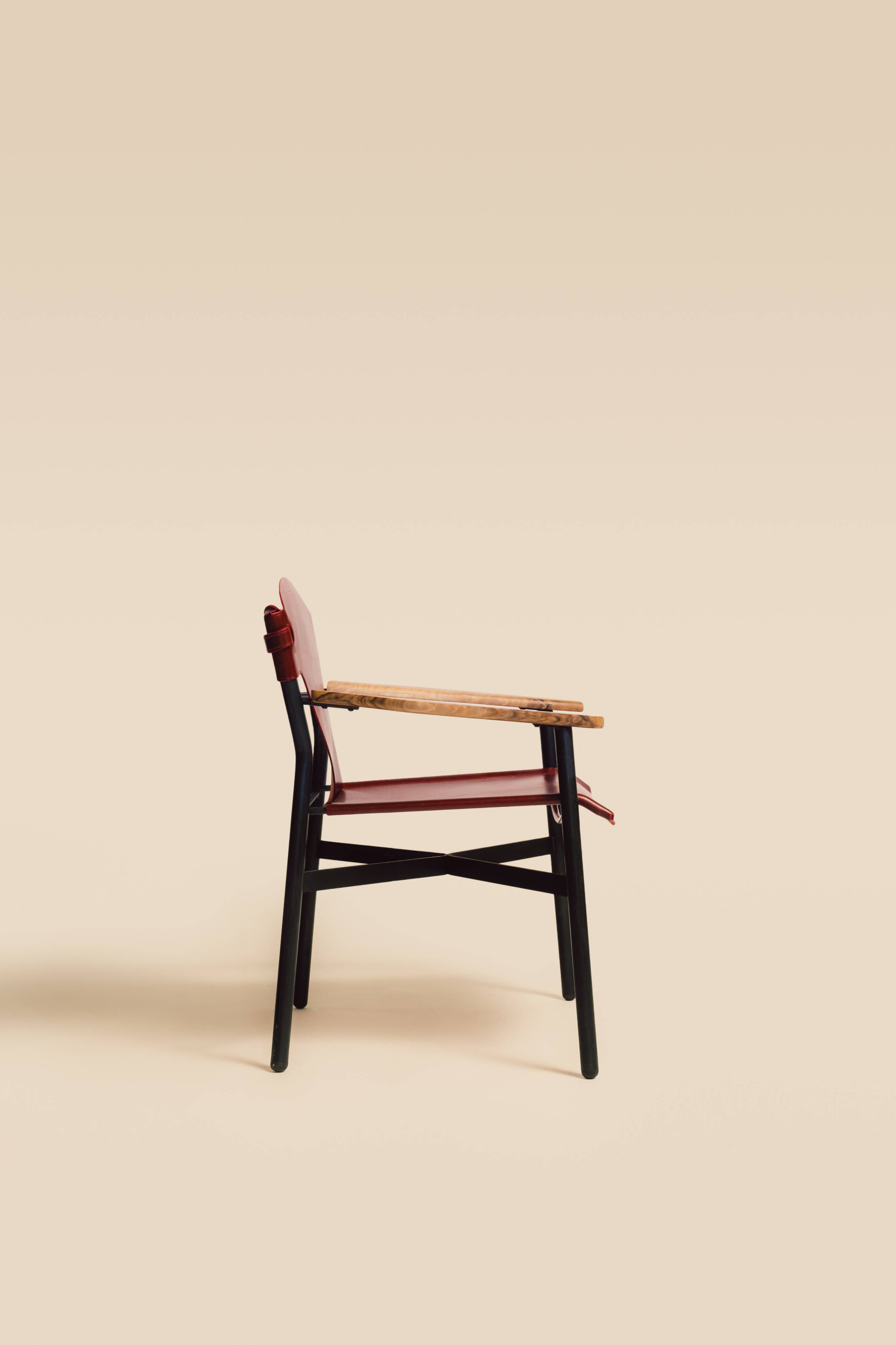 Maërl armchair, Galathée model, red leather, solid wood armrests of your choice